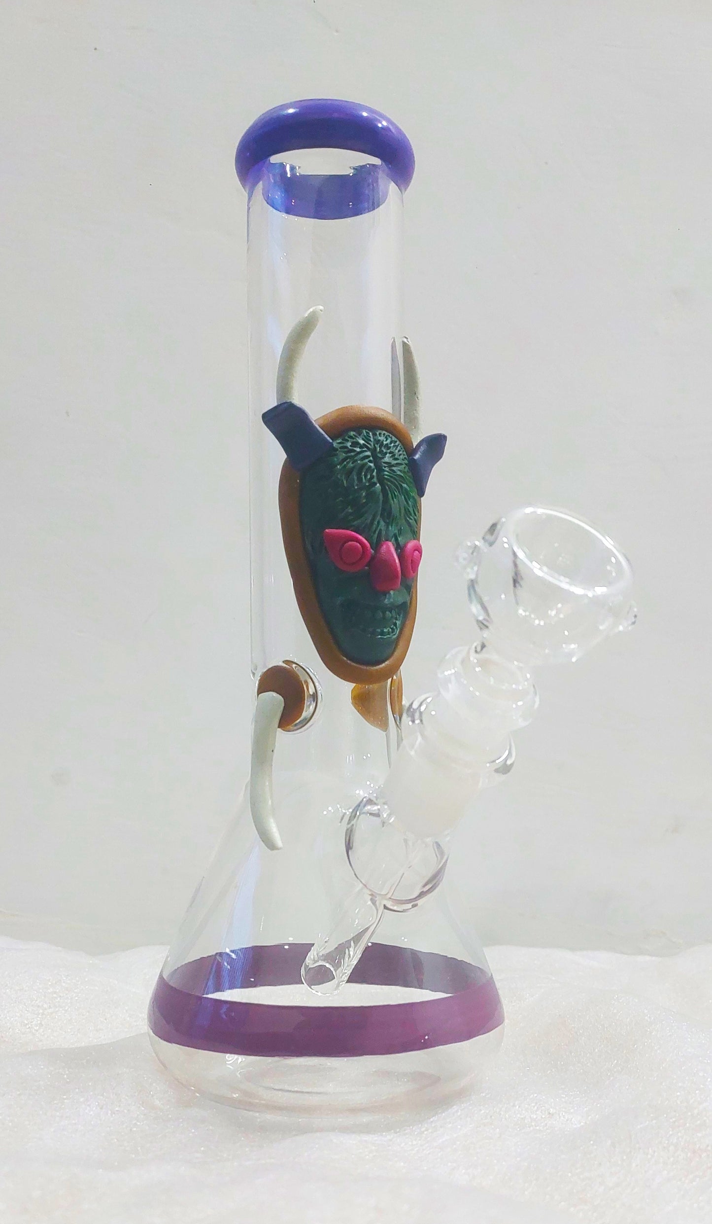 Devil's Brain Glass Bong, Glass water pipe with decorative head piece on a white background, instant delivery in delhi ncr, pan india smoking accessories brand theboomboxclub, bongs in delhi ncr, best quality bongs in india, glass bong shooters, rolling papers, rolling trays and smoking weed accessories in india, ckassic weed bongs, dankest smoke shop in india