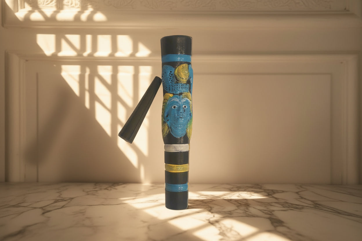 A 7-inch Black Shiva Clay Chillum with a multicolored design, featuring predominantly black with blue and yellow accents, displayed against a white background. clay chillums online instant delivery, hippie stoner weed hash chillums