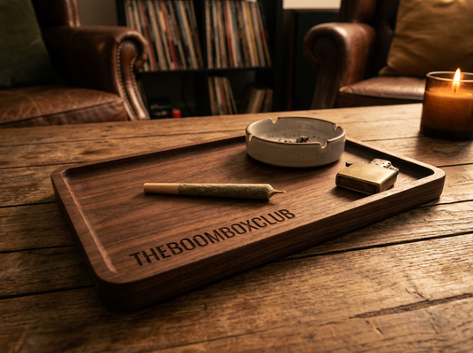Hands preparing a neat rolled joint with paper, filter and rolling tray, TBBC step-by-step rolling guide