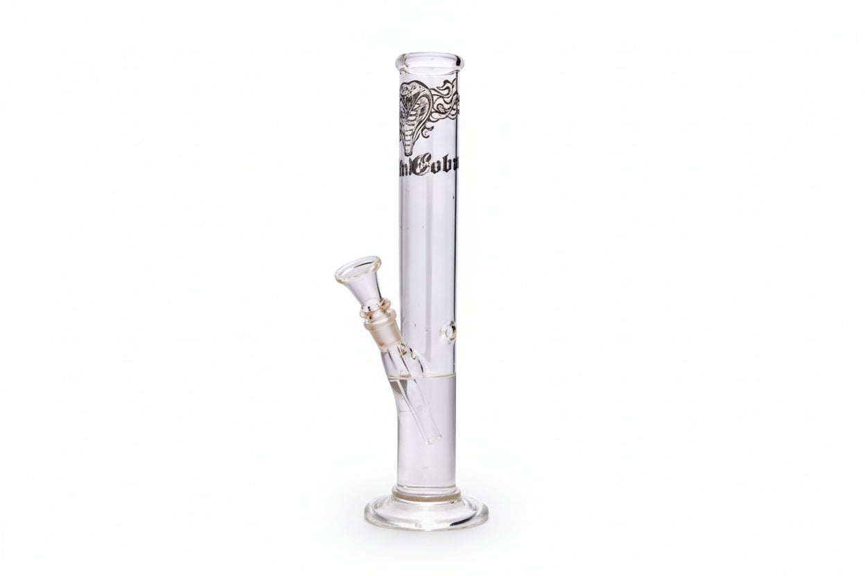A clear cylinder glass bong with white accents and a pattern near the base.