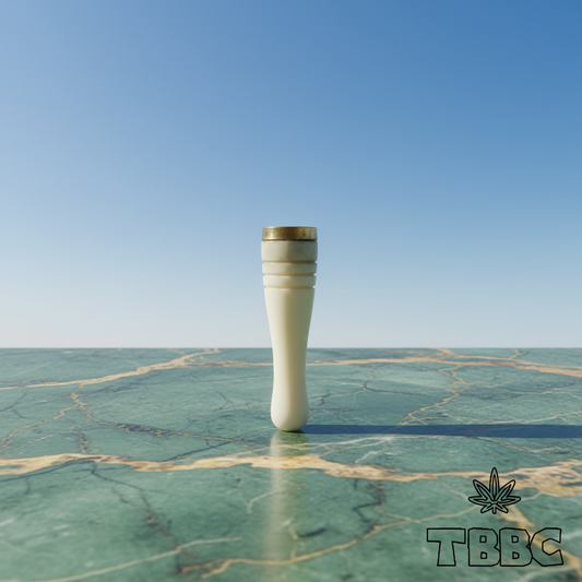 TBBC handcrafted ivory epoxy resin filter tip with brass ring and fine groove details on marble and sky lifestyle background