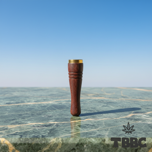 TBBC handcrafted wooden filter tip with dark wood, brass ring and fine groove details on marble and sky lifestyle background