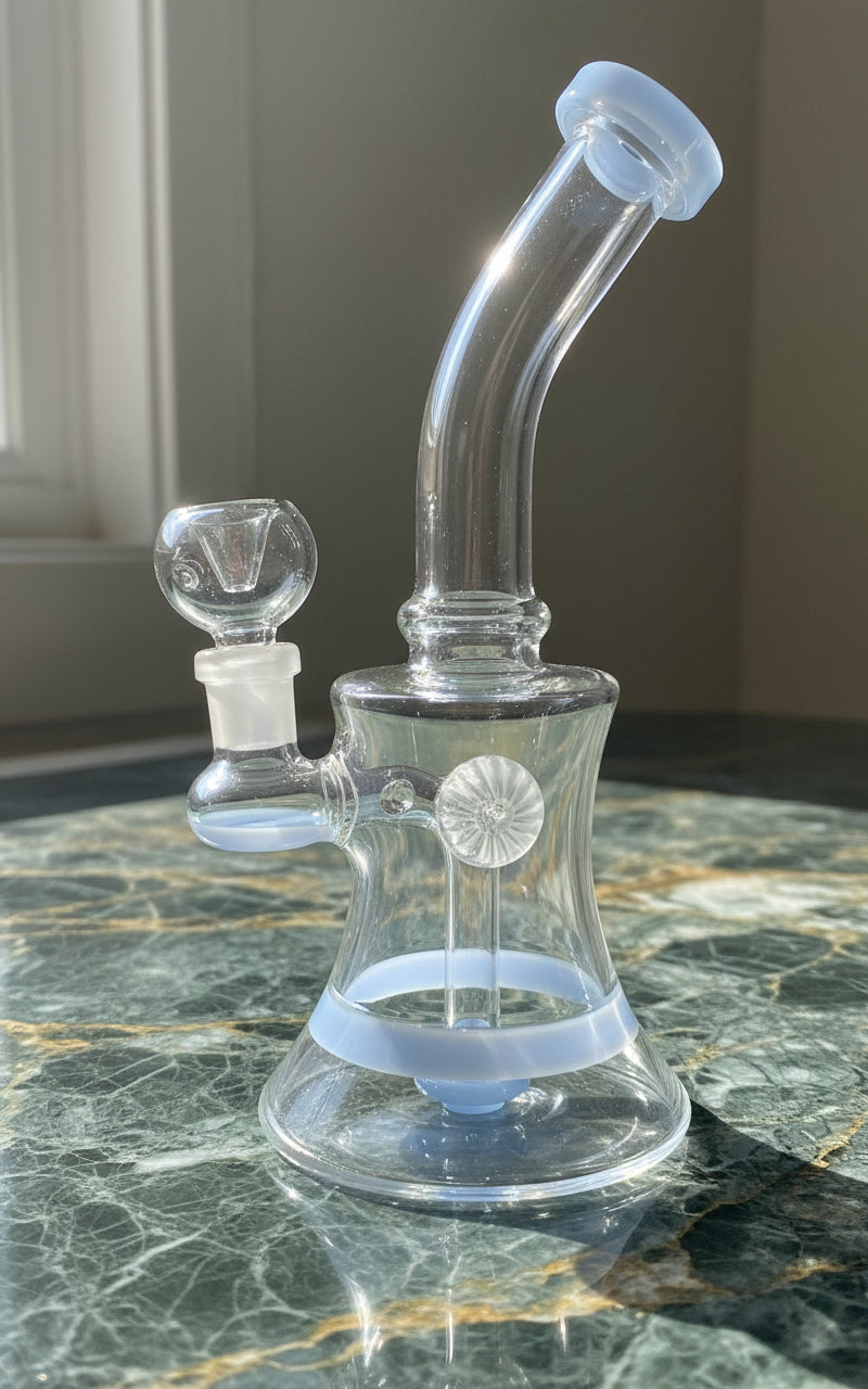 blue fish eye glass bong 8 inch under sunlight on a green and yellow textured table