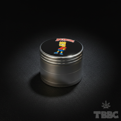 50mm 4-part metallic herb grinder with Backwoods Bart lid artwork, shown against a dark luxury background.