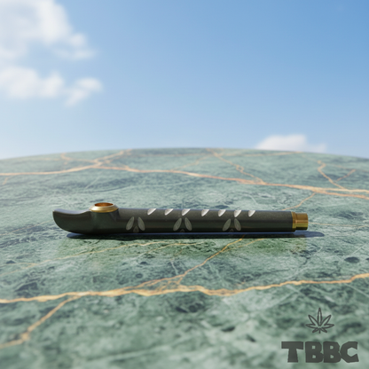 Side view of Medwakh Dokha Pipe Grey Smoke Drip on marble and sky background, graphite resin body with subtle white petal pattern