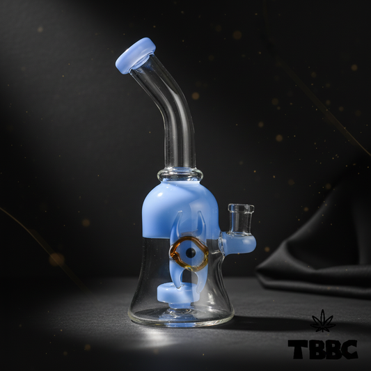 Mini dab rig 8 inch with 14mm joint, clear borosilicate glass, blue accents and nazar eye detail on dark background