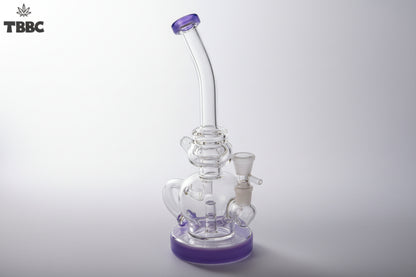Clear glass water pipe with purple accents on a white background, featuring the TBBC logo. 