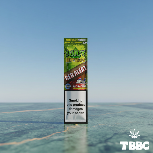 Juicy Jay’s Red Alert natural hemp wraps pack containing two wraps on a marble surface with sky background