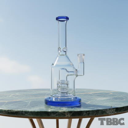 Blue Tide 8 inch borosilicate glass showerhead bong with 14mm male joint, blue base and blue rim on marble and sky background