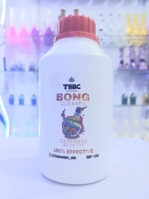 A bottle of TBBC Bong Cleaner with a label depicting a graphic of a bong and the text '100% Effective'. Isopropyl alcohol online india. bong cleaner 