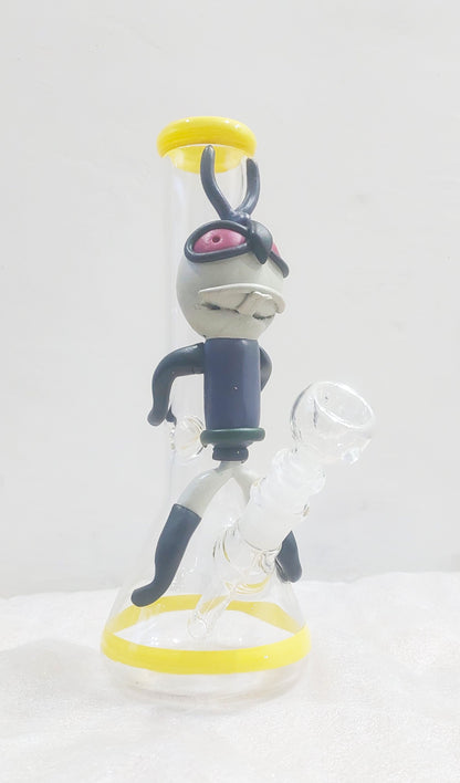 Animated character figurine with a white background, Close-up of a Trippy acid boy glass dick bong with yellow and black parts on a white background, instant delivery in delhi ncr, pan india smoking accessories brand tbbc theboomboxclub