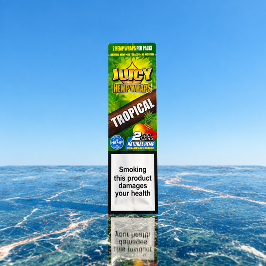 Juicy Jay’s Tropical natural hemp wraps pack containing two wraps on a marble surface with sky background