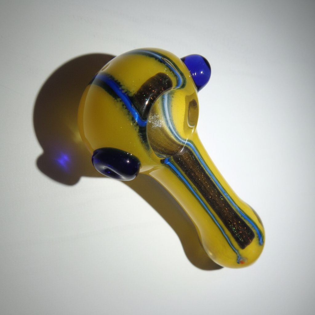 Yellow weed glass pipe with blue accents on a white background, instant delivery indehi ncr