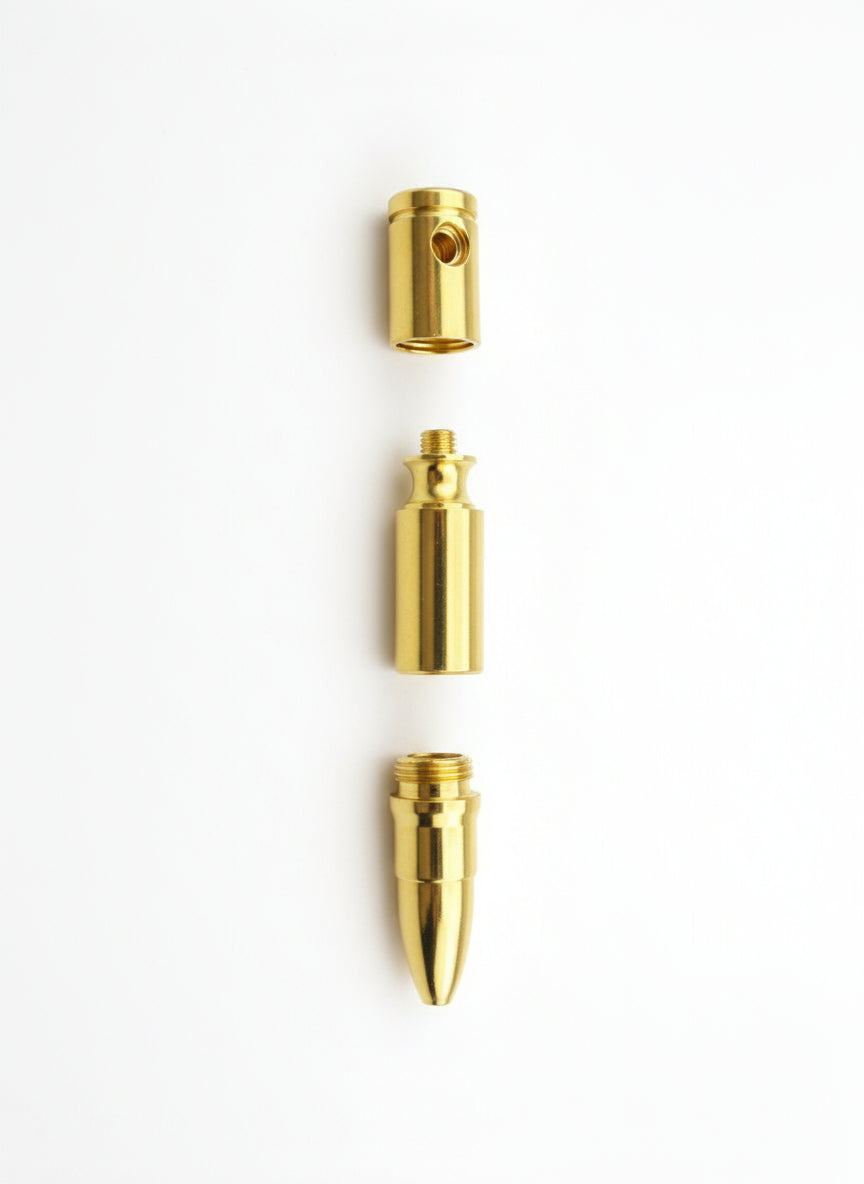 Three gold-colored metal components on a white background
Gold-colored bullet on a gray background, smoking metal golden hand pipes , instant delivery for smoking accessories for stoners, hippie smoking pipes, no tar no heat hand pipes
