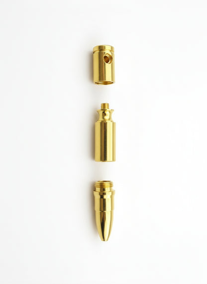 Three gold-colored metal components on a white background
Gold-colored bullet on a gray background, smoking metal golden hand pipes , instant delivery for smoking accessories for stoners, hippie smoking pipes, no tar no heat hand pipes