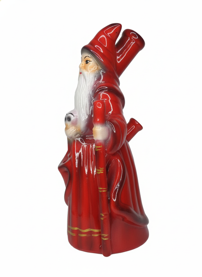Red glass figurine of a Santa-like figure with a white beard on a white ,Side view red ceramic sage pipe showing metal hitter slot and gold detailing
background
