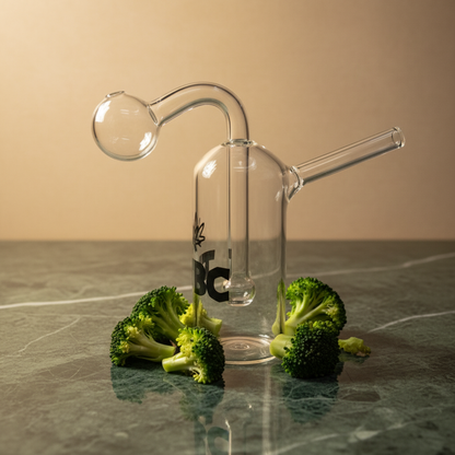 Clear glass smoking device with broccoli on a reflective surface,
mini oil bong glass water pipe 45 degree view TBBC