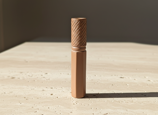 TBBC Helix Italian Style Clay Chillum with helix carving on sunlit sand background, premium handcrafted smoking accessory