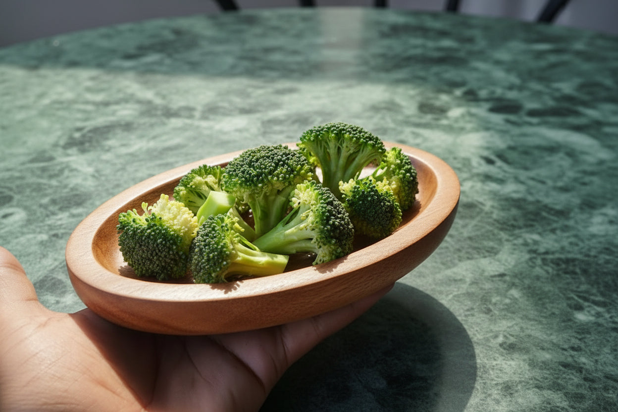 TBBC Wooden Rolling Tray side view - showing raised edges and natural wood grain with some veggies inside for crushing or grinding