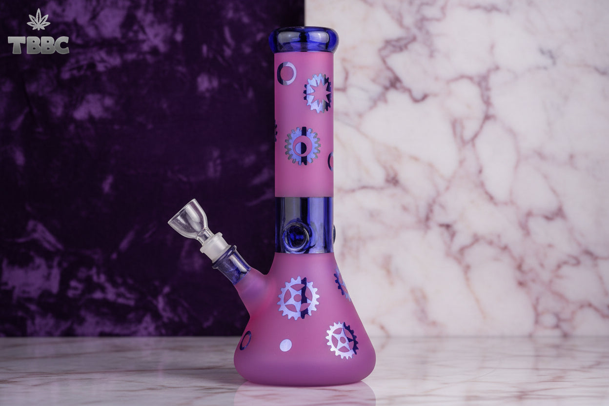A 12 inch tall heavy ice bong with a purple base and blue top, featuring a geometric pattern design. Instant delivery in delhi ncr, express delivery pan india, exporter for exclusive bongs india