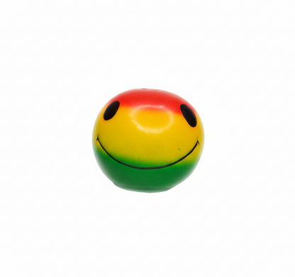 Close-up rasta smiley face ceramic bong showing red yellow green gradient design