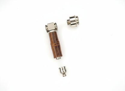 Three small mechanical components on a white background
Small tool with a brown handle and metallic end on a light gray background, raw wood metal smoking weed hand pipe, easy to carry and clean smoking pipes for export, wholesale smoking pipes manufacturer, quality smoking pipes online instant delivery 