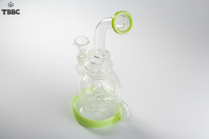 Glass smoking device with green accents on a white background, featuring the TBBC logo. exporter of bongs india, super quality bongs collection online