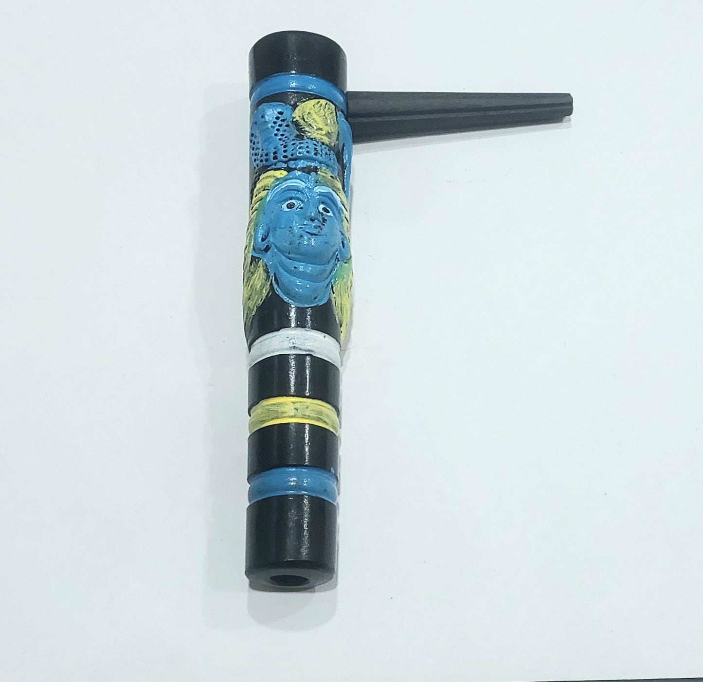 A 7-inch Black Shiva Clay Chillum with a multicolored design, featuring predominantly black with blue and yellow accents, displayed against a white background. clay chillums online instant delivery, hippie stoner weed hash chillums