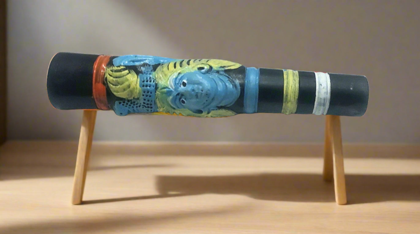 A 7-inch Black Shiva Clay Chillum with a multicolored design, featuring predominantly black with blue and yellow accents, displayed against a white background. clay chillums online instant delivery, hippie stoner weed hash chillums