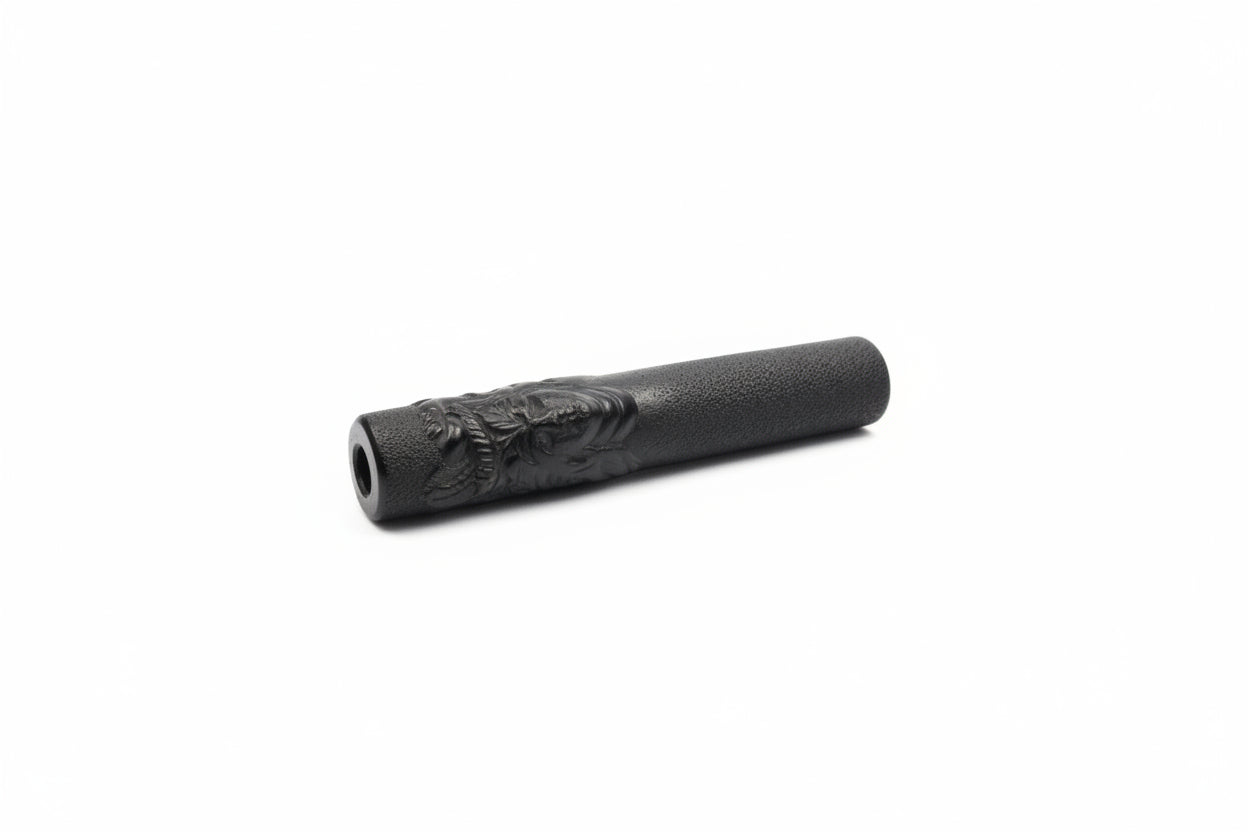 Black textured cylindrical object on a white background