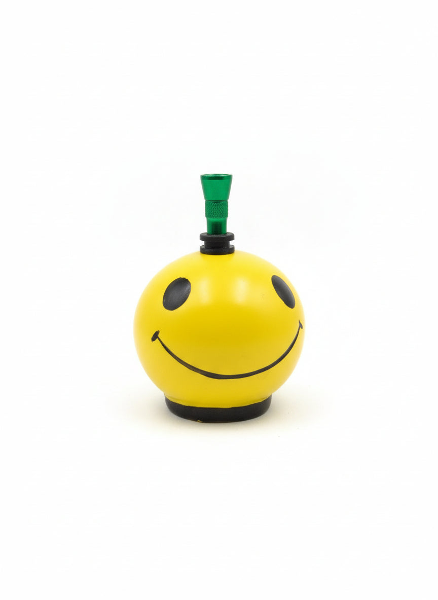 Top view yellow ceramic bong with green metal hitter and rubber grommet seal