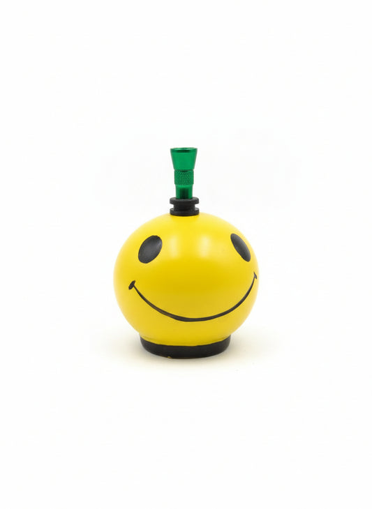 Top view yellow ceramic bong with green metal hitter and rubber grommet seal