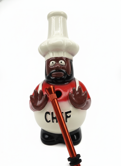 Figurine of a chef character holding a red bong shooter on a white background, Decorative bowling pin shaped like a chef with a white hat and red shirt on a white background. chef og pioneer of Bong rips ceramic water pipe, stoners 420 quirky stoner weed ganja kief hashish hydroponics, smoking accessories exporter from INDIA