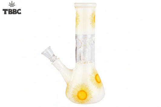 A beige-colored glass bong with a sunburst pattern, featuring yellow and orange hues, and ice spikes on the side.